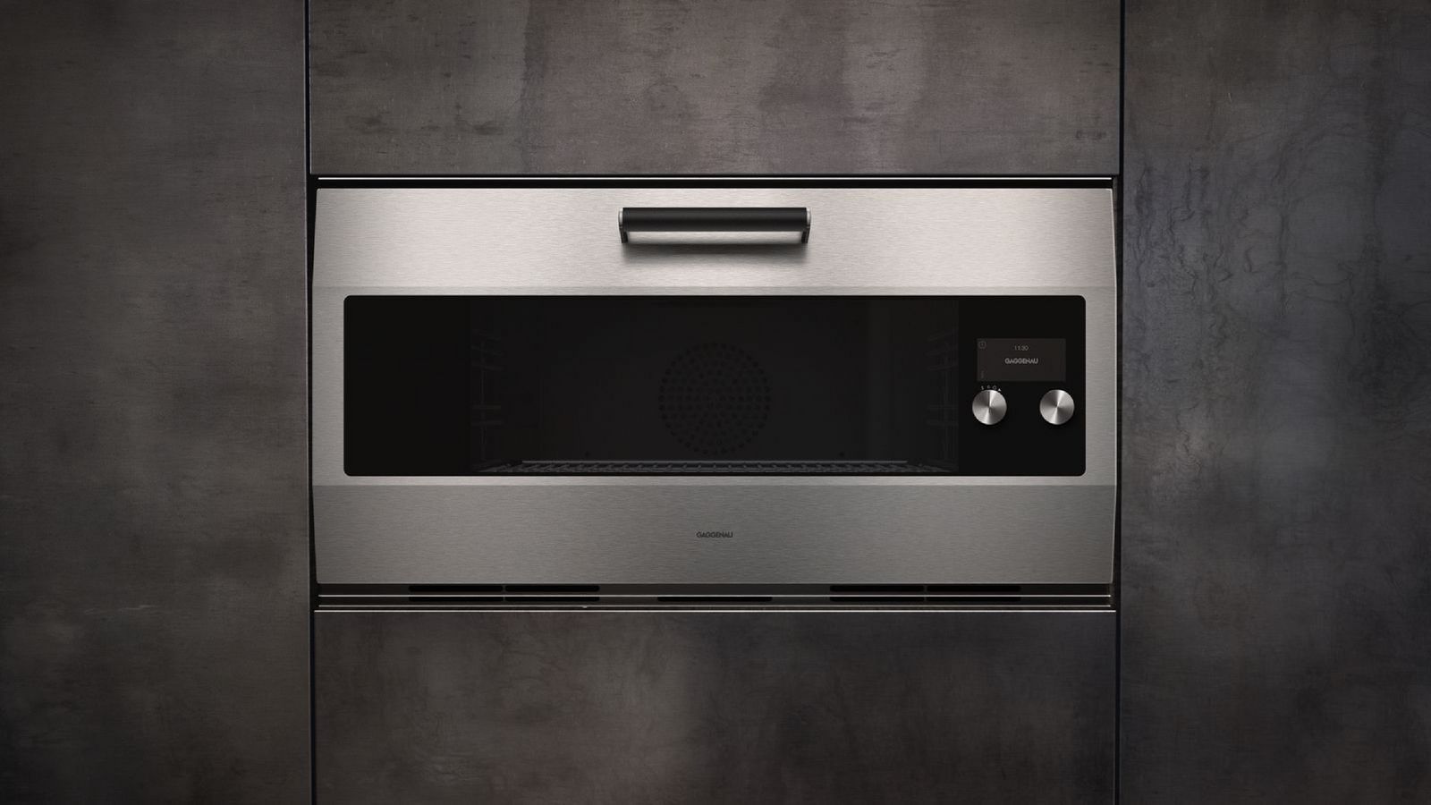 Gaggenau EB 333 stainless steel oven built into dark cabinetry