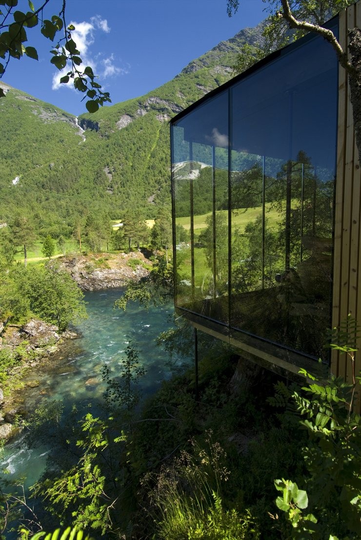 Glass cabin at Juvet Landscape Hotel above a Norwegian river