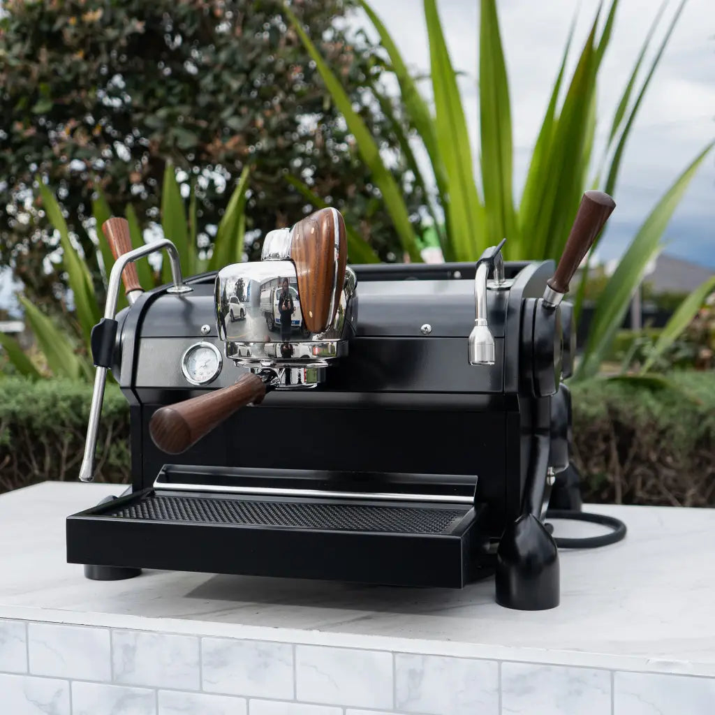 Matte black Slayer Single Group espresso machine with wood controls