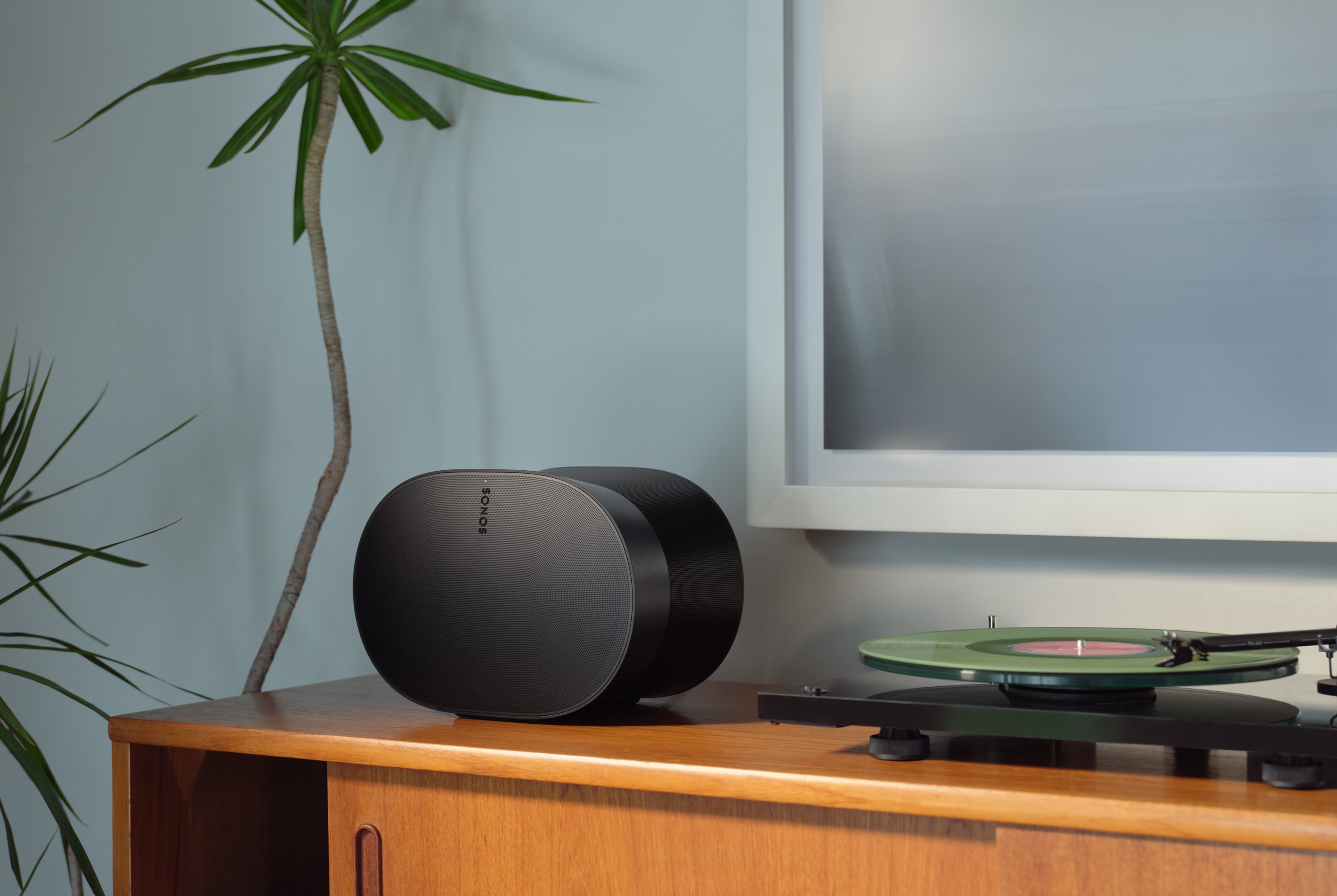 Sonos Era 300 speaker beside a turntable