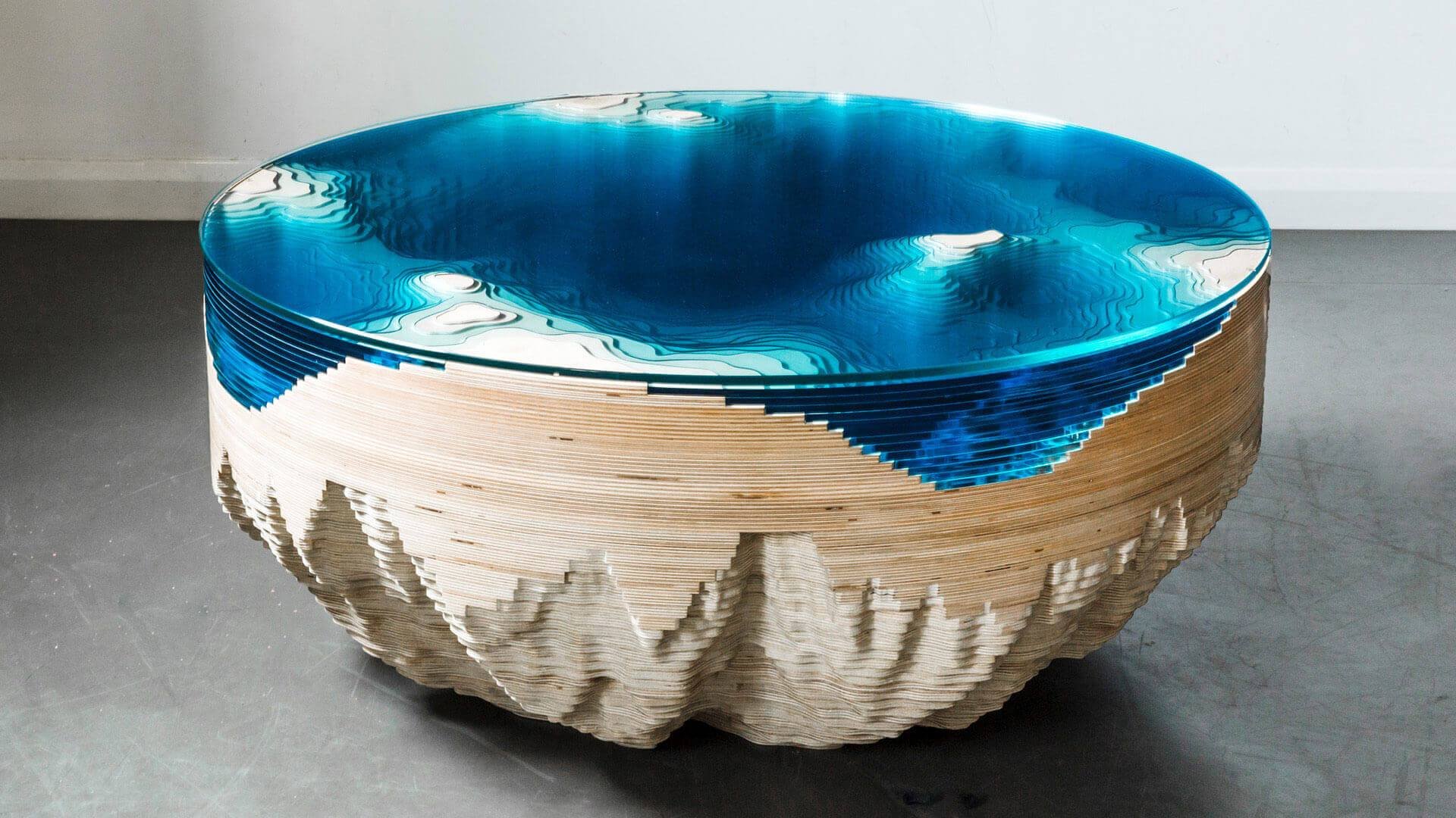 Duffy London Abyss Horizon circular coffee table in layered wood and blue glass, seen from above and the side